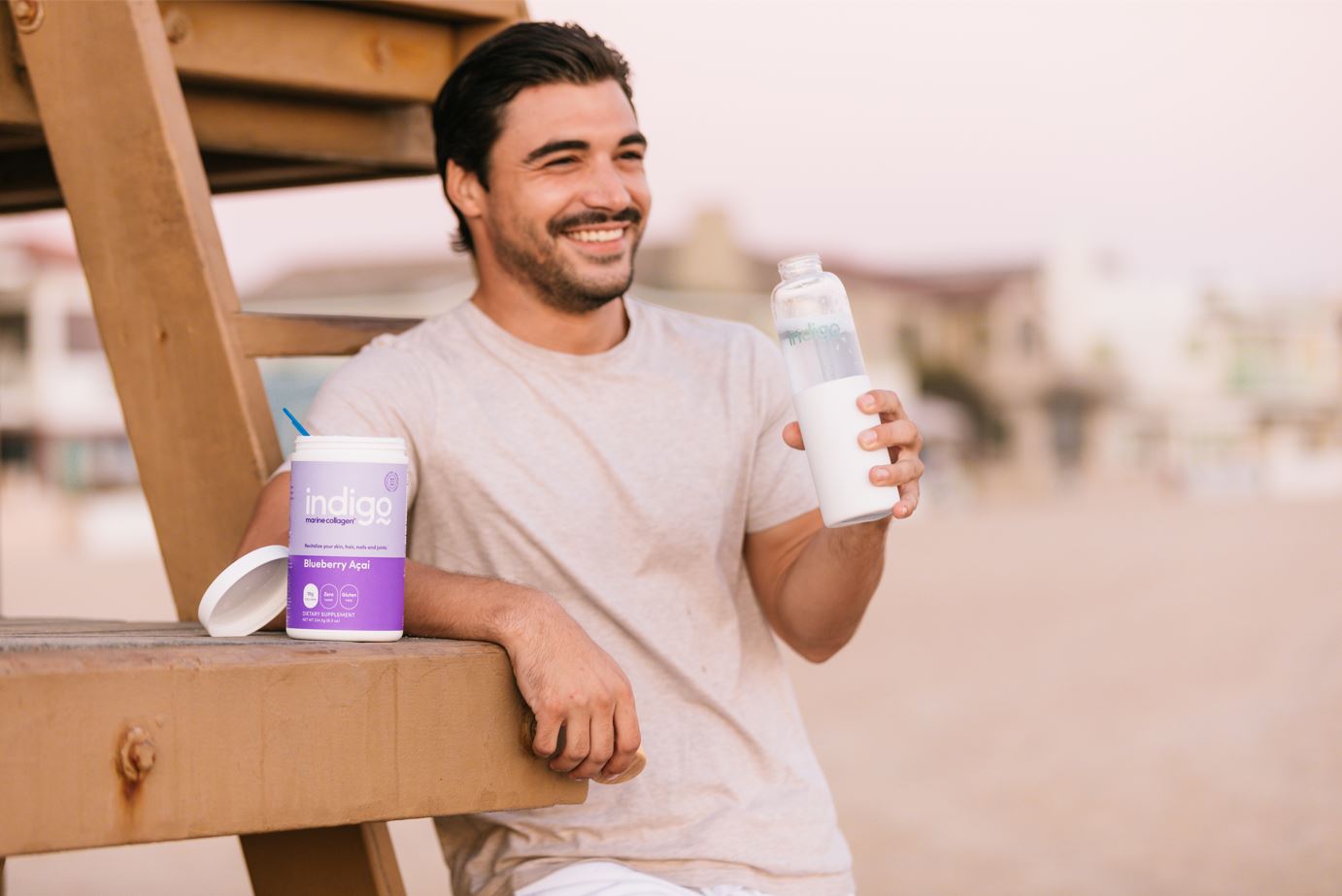 Man on Beach Drinking Indigo Marine Collagen Peptides