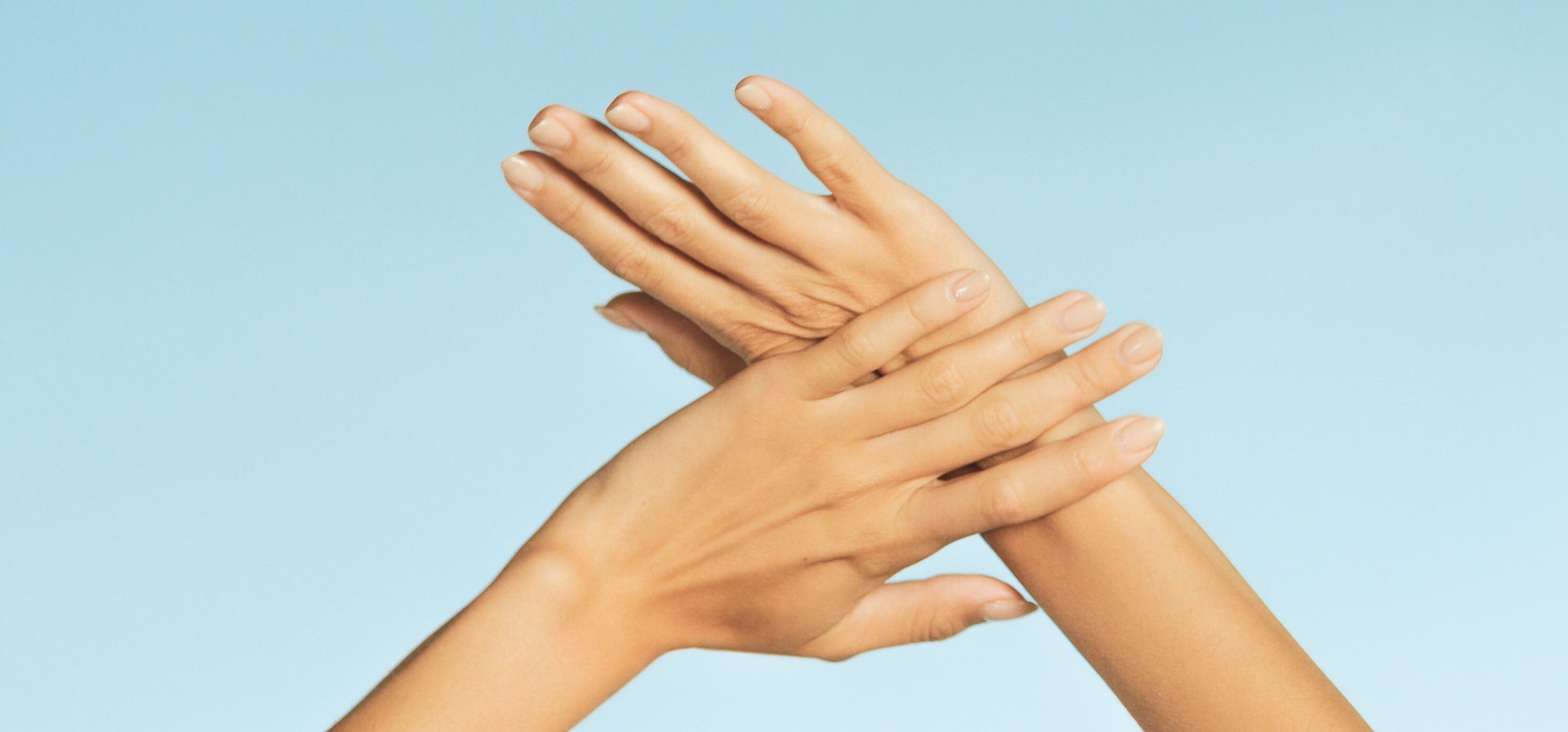 Women with Hands to the sky showing Health Nails 