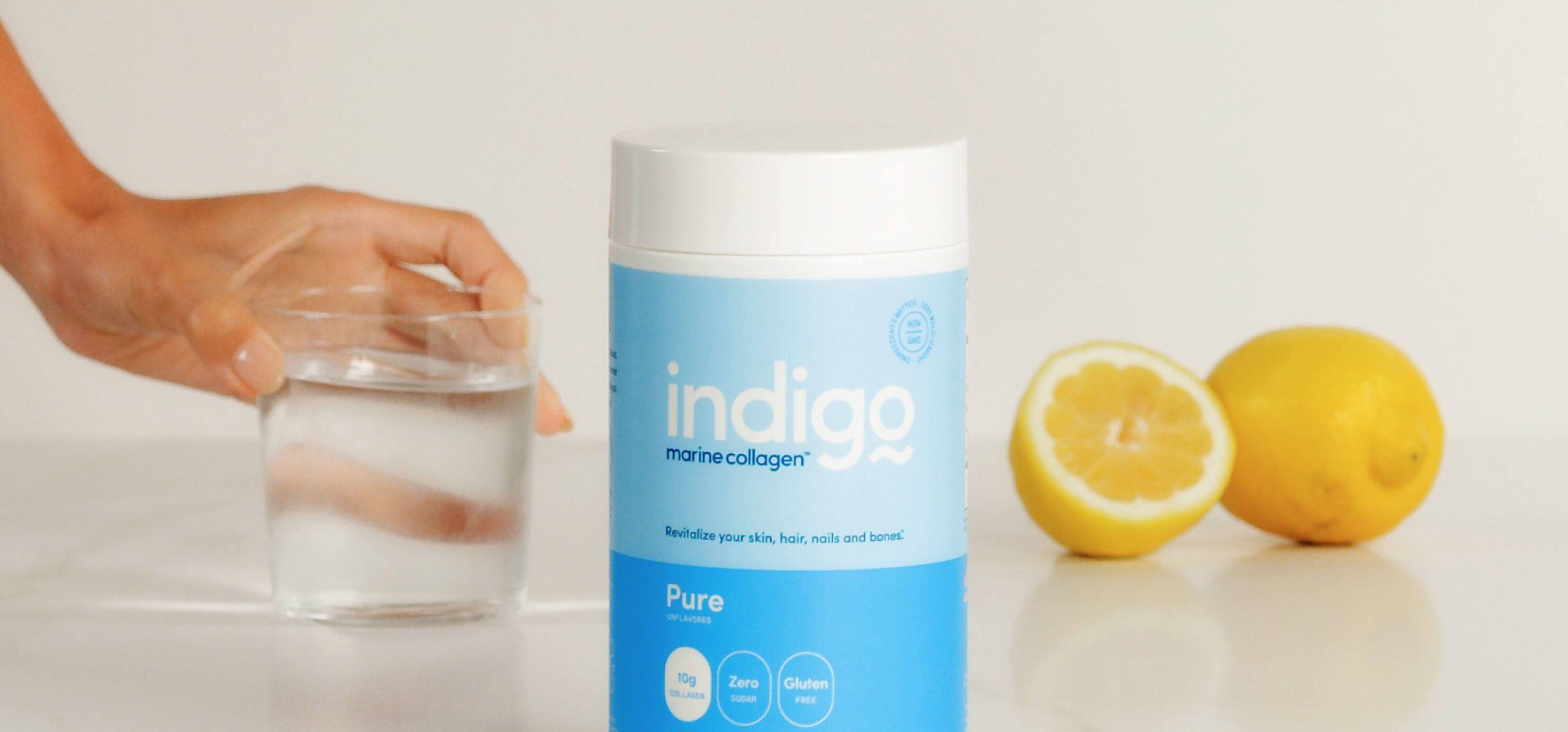 Indigo Marine Collagen Peptides and Glass of Water